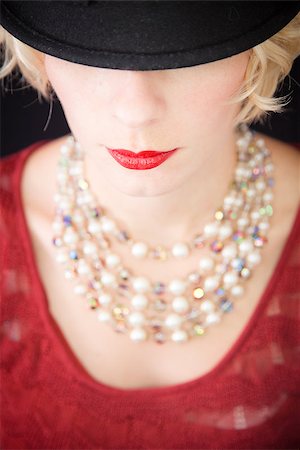 Beautiful lady with an old fashioned style shot in studio with a black background. Photographie de stock - Aubaine LD & Abonnement, Code: 400-06789029