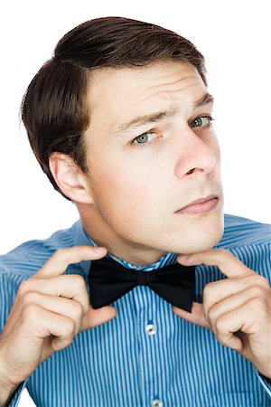 Handsome gentleman with a bow tie isolated on a white background Stock Photo - Budget Royalty-Free & Subscription, Code: 400-06789034