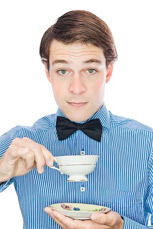 Handsome gentleman with a bow tie isolated on a white background Stock Photo - Budget Royalty-Free & Subscription, Code: 400-06789035
