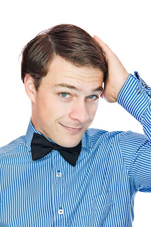 Handsome gentleman with a bow tie isolated on a white background Stock Photo - Budget Royalty-Free & Subscription, Code: 400-06789038