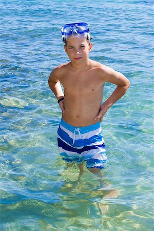 Cute eleven years old boy staying in the sea Stockbilder - Microstock & Abonnement, Bildnummer: 400-06794010