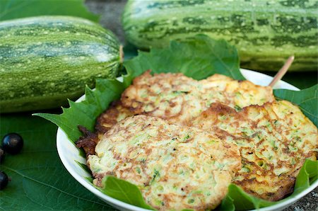 pancake bake - Pancakes with fresh zucchini on grape leaves Stock Photo - Budget Royalty-Free & Subscription, Code: 400-06794079