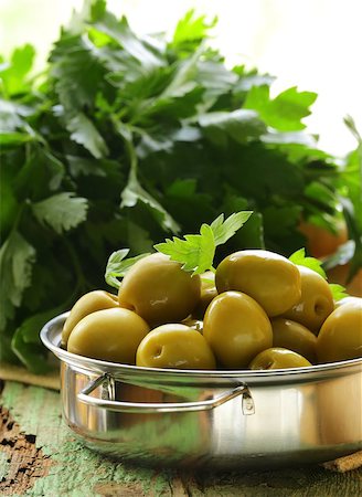simsearch:400-07219392,k - green  marinated olives with herbs  on a wooden table Stock Photo - Budget Royalty-Free & Subscription, Code: 400-06794256