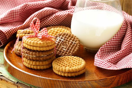 homemade cookies (sandwich) with milk on a wooden table Stock Photo - Budget Royalty-Free & Subscription, Code: 400-06794259