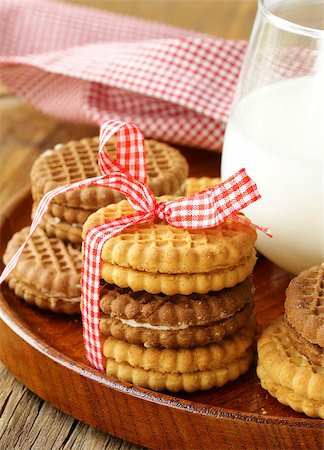 homemade cookies (sandwich) with milk on a wooden table Stock Photo - Budget Royalty-Free & Subscription, Code: 400-06794260
