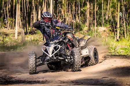 safety helmet dirt - ATV racer takes a turn during a race on a dusty terrain. Photographie de stock - Aubaine LD & Abonnement, Code: 400-06794434