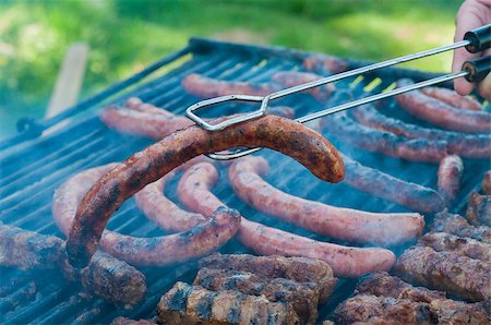 Sausages being cooked on the grill durin summer Stock Photo - Budget Royalty-Free & Subscription, Code: 400-06794443