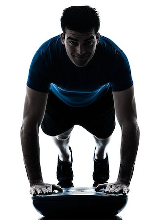 one caucasian man exercising push ups on bosu workout fitness in silhouette studio  isolated on white background Photographie de stock - Aubaine LD & Abonnement, Code: 400-06794879