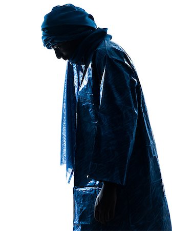 one Tuareg Portrait in silhouette studio isolated on white background Fotografie stock - Microstock e Abbonamento, Codice: 400-06794923