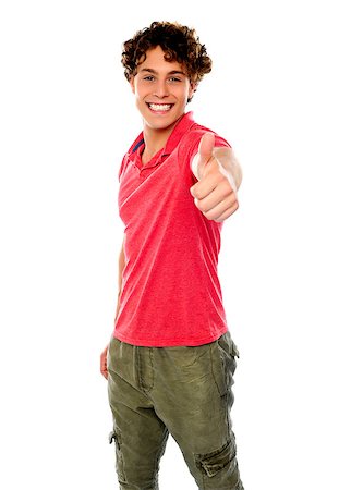 simsearch:400-06795514,k - Smart guy standing with thumbs-up against white background Photographie de stock - Aubaine LD & Abonnement, Code: 400-06795531