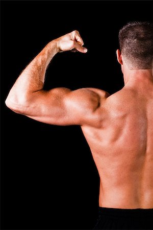simsearch:400-05082999,k - Muscular man isolated on black background Stock Photo - Budget Royalty-Free & Subscription, Code: 400-06795966