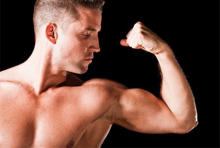 simsearch:400-05082999,k - Muscular man isolated on black background Stock Photo - Budget Royalty-Free & Subscription, Code: 400-06795971