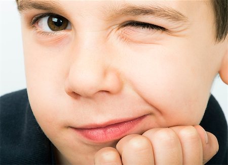 deyangeorgiev (artist) - Little boy wink of an eye. Close up studio shot Fotografie stock - Microstock e Abbonamento, Codice: 400-06796579