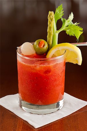 pickled lemon - bloody mary cocktail isolated on a busy bar top garnished with onions, olives, asparagus and celery Stock Photo - Budget Royalty-Free & Subscription, Code: 400-06797126