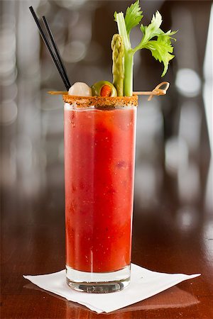salt rim - bloody mary cocktail isolated on a busy bar top garnished with onions, olives, asparagus and celery Stock Photo - Budget Royalty-Free & Subscription, Code: 400-06797127