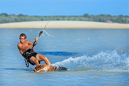 fortaleza - young and talented kitesurfer in brazil tatajuba, Jericoacoara ceara Fotografie stock - Microstock e Abbonamento, Codice: 400-06797335