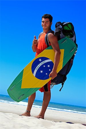 fortaleza - Kite surfer with the brazilian flag painted on the board with "praia e vento" (beach and wind) instead of "ordem e progresso"  in prainha beach near fortaleza Fotografie stock - Microstock e Abbonamento, Codice: 400-06797337