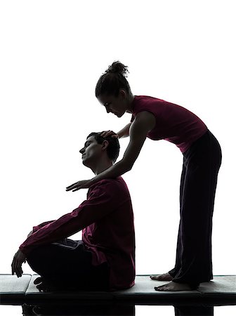 full body massage - one man and woman performing thai massage in silhouette studio on white background Foto de stock - Super Valor sin royalties y Suscripción, Código: 400-06797346