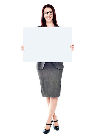 employee hold a sign - Portrait of a happy young woman holding a blank billboard over white background Stock Photo - Budget Royalty-Free & Subscription, Code: 400-06797905