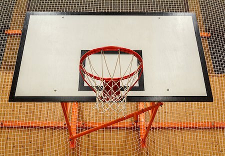 Basketball hoop cage in public gym with safety net Stock Photo - Budget Royalty-Free & Subscription, Code: 400-06798664