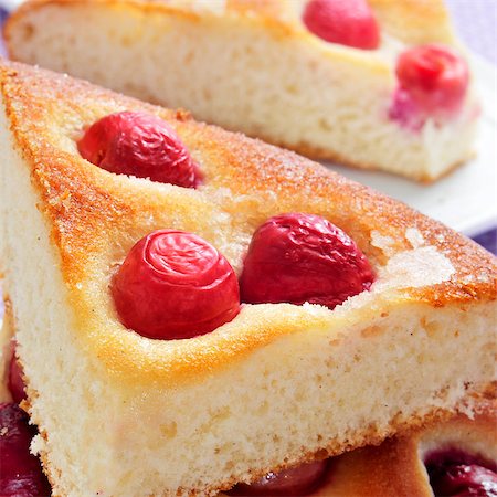 closeup of some pieces of coca amb cireres, typical catalan cake with cherries for Feast of Corpus Christi Stock Photo - Budget Royalty-Free & Subscription, Code: 400-06799062