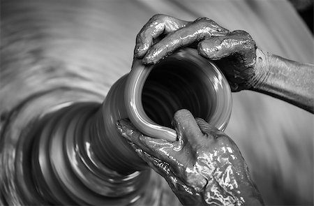 potters hands - Man's hands creating pottery on wheel, monochrome vintage view Stock Photo - Budget Royalty-Free & Subscription, Code: 400-06799230