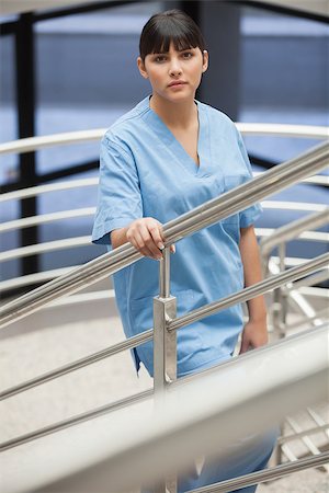 simsearch:400-06799497,k - Nurse on the stairs in hospital corridor Stockbilder - Microstock & Abonnement, Bildnummer: 400-06799574