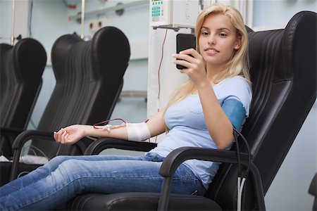 Blonde woman relaxing in a chair while getting dialysis n hospital Stock Photo - Budget Royalty-Free & Subscription, Code: 400-06799781