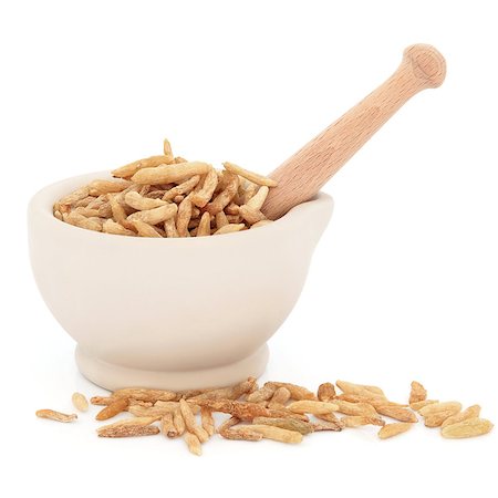 simsearch:400-06521200,k - Chinese herbal medicine of lily turf root in a stone mortar with pestle over white background. Stockbilder - Microstock & Abonnement, Bildnummer: 400-06790168