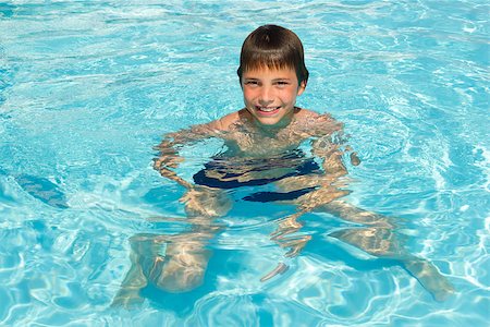 simsearch:400-06794010,k - Activities on the pool. Cute boy swimming and playing in water in swimming pool Stock Photo - Budget Royalty-Free & Subscription, Code: 400-06790194
