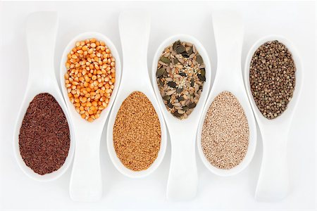 simsearch:400-07993031,k - Seed food selection in porcelain spoons over white background. Foto de stock - Super Valor sin royalties y Suscripción, Código: 400-06790196