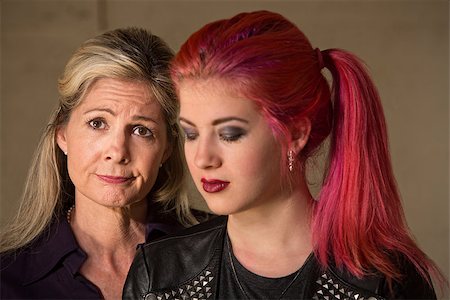 parent comforting teen - Mature woman with teenage girl in pink hair looking down Stock Photo - Budget Royalty-Free & Subscription, Code: 400-06790533