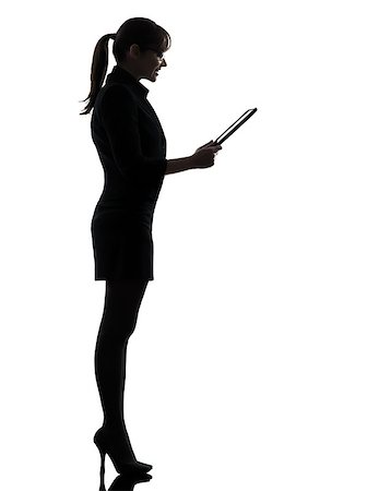people ipad computer studio - one business woman computer computing digital tablet  silhouette studio isolated on white background Stock Photo - Budget Royalty-Free & Subscription, Code: 400-06790819