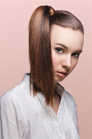 simsearch:400-06790945,k - close-up portrait of pretty young girl with brown hair, ponytail on the right and white shirt Photographie de stock - Aubaine LD & Abonnement, Code: 400-06790939