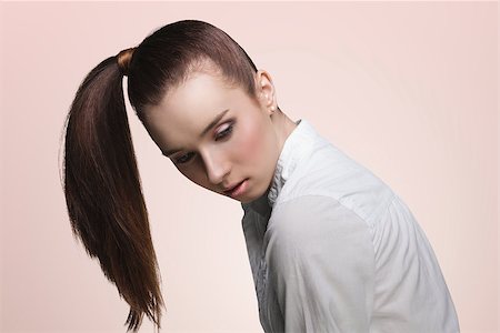 simsearch:400-06790945,k - sensual young girl with brown ponytail hairstyle on the right, pretty make-up  wearing white shirt Photographie de stock - Aubaine LD & Abonnement, Code: 400-06790940