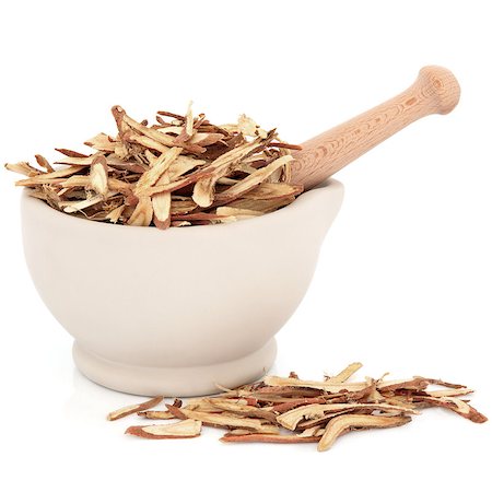 simsearch:400-06521200,k - Chinese herbal medicine of licorice root in a stone mortar with pestle over white background. Stock Photo - Budget Royalty-Free & Subscription, Code: 400-06790962