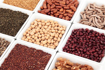 simsearch:400-07993031,k - Healthy super food selection of pulses, nuts, seeds, cereal, tea in white porcelain dishes over white background. Selective focus. Foto de stock - Super Valor sin royalties y Suscripción, Código: 400-06791011