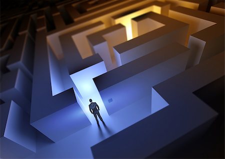 A businessman with a challenge / maze ahead of him. Fotografie stock - Microstock e Abbonamento, Codice: 400-06791020