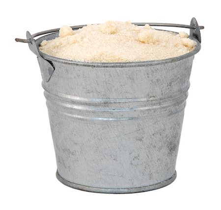 Golden caster sugar in a miniature metal bucket, isolated on a white background Stock Photo - Budget Royalty-Free & Subscription, Code: 400-06791327