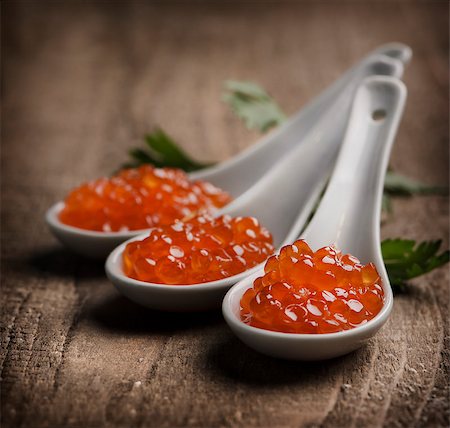 fish restaurant - Caviar in white spoon on wooden table Foto de stock - Super Valor sin royalties y Suscripción, Código: 400-06791438