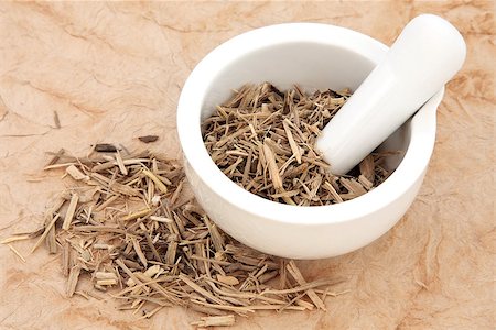 simsearch:400-07174356,k - Ginseng root herb in a mortar with pestle and loose over papyrus background. Stock Photo - Budget Royalty-Free & Subscription, Code: 400-06791577