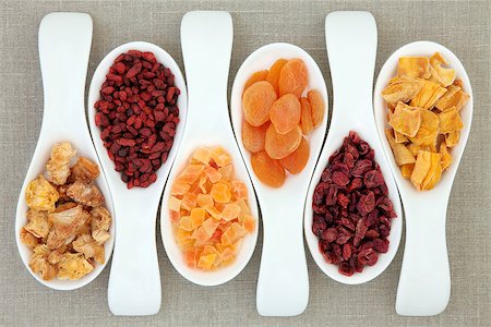 simsearch:400-07510855,k - Dried fruit in white porcelain scoops over hessian background. Photographie de stock - Aubaine LD & Abonnement, Code: 400-06791584