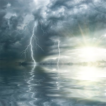 sun sky rain - Thunderstorm with rain and lightning over ocean, the sun shines through clouds Stock Photo - Budget Royalty-Free & Subscription, Code: 400-06792935