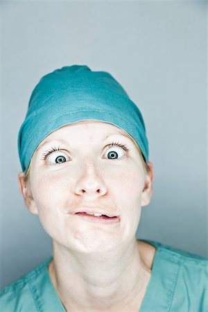 Young nurse in studio on a gray background Stock Photo - Budget Royalty-Free & Subscription, Code: 400-06792947