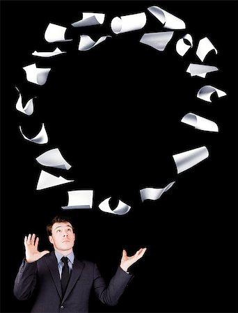 Businessman manipulating sheets of paper isolated on black background Photographie de stock - Aubaine LD & Abonnement, Code: 400-06792979