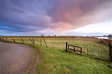 simsearch:400-06875459,k - dramatic sunrise over road and fence Stock Photo - Budget Royalty-Free & Subscription, Code: 400-06793656