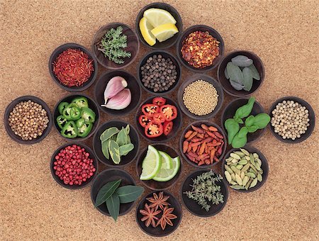 simsearch:400-06365740,k - Herbs, spices and food ingredient selection in wooden bowls over cork background. Stockbilder - Microstock & Abonnement, Bildnummer: 400-06793994