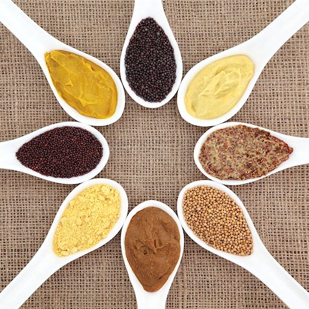 simsearch:400-06327283,k - Mustard selection of powder, seed, french, dijon, english and wholegrain in white porcelain spoons over hessian background. Stock Photo - Budget Royalty-Free & Subscription, Code: 400-06793998