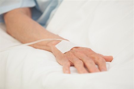 patient on bed and iv - Hand with intravenous drip in hospital bed Stock Photo - Budget Royalty-Free & Subscription, Code: 400-06800580