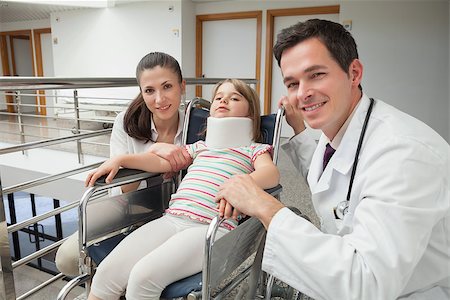 paraplegic women in wheelchairs - Smiling doctor, mother and her child with neck brace in wheelchair Stock Photo - Budget Royalty-Free & Subscription, Code: 400-06800642